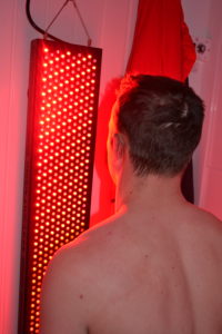 Standing in front of a Red Light Panel at Cryojuvenate 