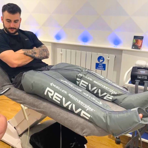 man looking at sports therapist whilst wearing compression therapy trousers in cryojuvenate in sevenoaks