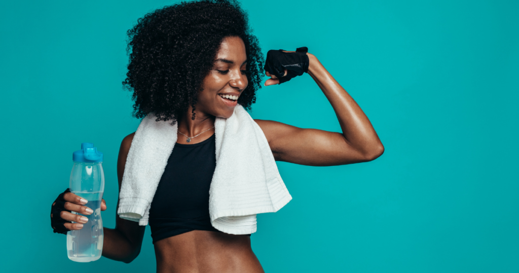 fitness woman flexing muscles - sports recovery